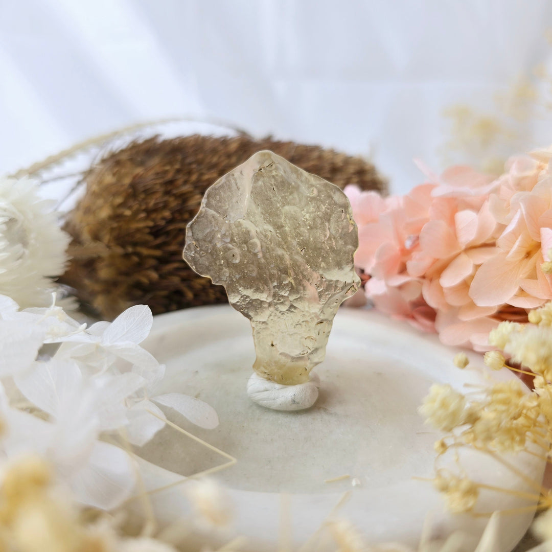 Raw Libyan Desert Glass specimen glowing pale gold