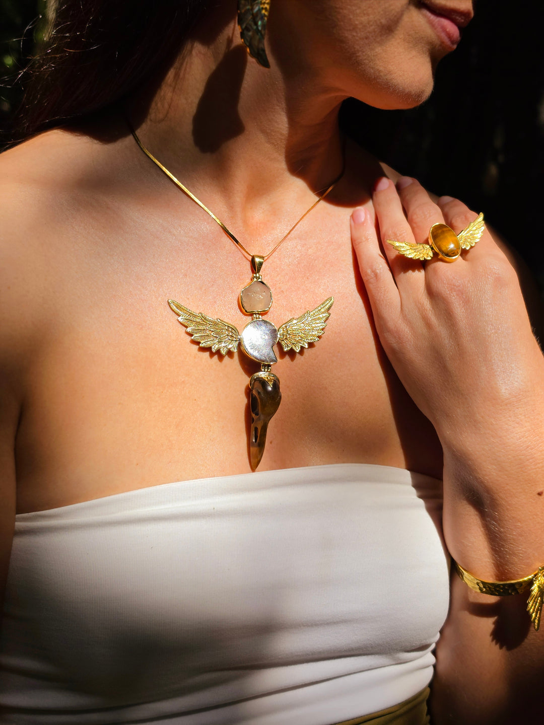 Libyan Desert Glass, Ammonite & Tigers Eye Raven Skull Anahata Brass Pendant